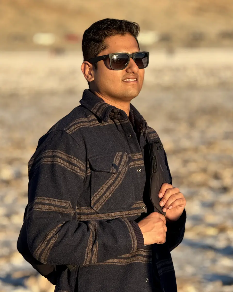 Portrait of Aditya Deshpande outdoors in warm evening light